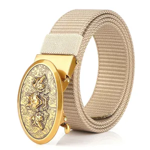 Tactical khaki nylon belt for men with a golden wolf head alloy buckle on white background