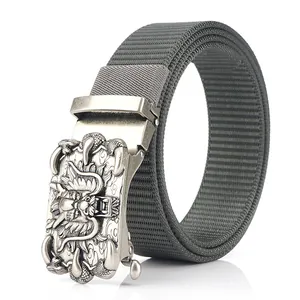 Men's gray nylon belt with silver dragon relief automatic buckle on white background