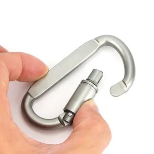 Tactical aluminum alloy D-shaped locking carabiner held by hand for outdoor survival