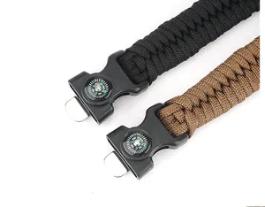 Detail of outdoor survival paracord bracelet with integrated compass and plastic buckle