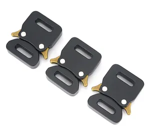 Macro detail of 15mm matte black cobra buckle with bronze quick release side levers