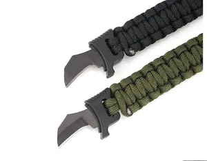 Detail of hidden crescent steel blade and paracord weave on survival bracelet