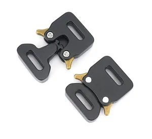 Detail of 15mm tactical cobra buckle showing black metal finish and gold release levers