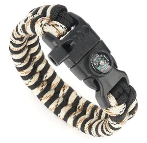 Detail of paracord survival bracelet with built-in compass, whistle and CE buckle