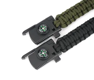 Detailed close-up of woven paracord survival bracelets with integrated compass and buckle