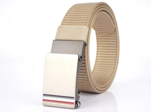 Detail of khaki nylon belt with alloy automatic buckle featuring brushed metal finish