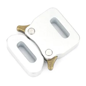 Macro shot of matte silver zinc alloy quick release buckle with brass levers for webbing