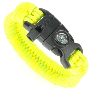 Detail of paracord survival bracelet with built-in compass, whistle, and buckle clasp