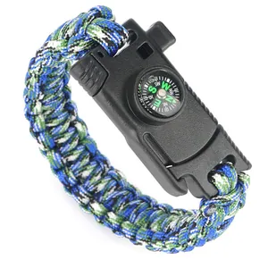 Detail of outdoor survival paracord bracelet featuring built-in compass and whistle buckle