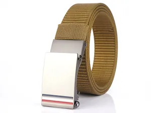 Detail of sand-colored nylon tactical belt with brushed metal automatic buckle and stripe