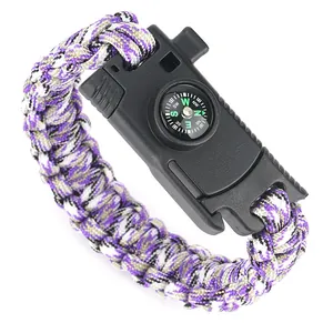 Detailed macro view of purple paracord weave with functional compass on buckle
