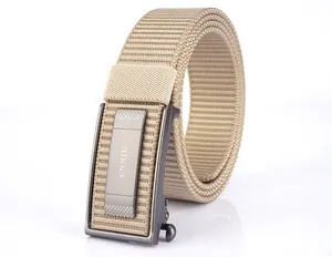 Detail of khaki nylon webbing belt with metallic automatic buckle featuring ENNIU text