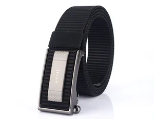 Close-up of black tactical nylon belt featuring a gray metal automatic buckle with logo