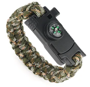 Detail of army green camo paracord survival bracelet with built-in mini compass