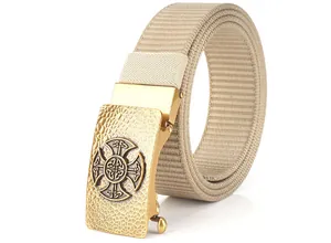 Detailed close-up of tactical nylon belt with vintage gold Celtic cross buckle