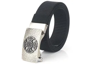 Close-up of black nylon canvas belt featuring a vintage silver buckle with Celtic cross