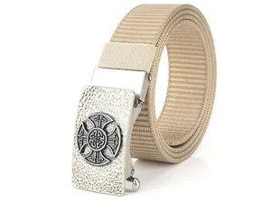 Close-up of beige nylon canvas belt featuring a vintage Celtic cross alloy buckle