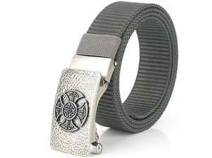 Detail of military green tactical nylon belt with metal buckle featuring embossed celtic cross
