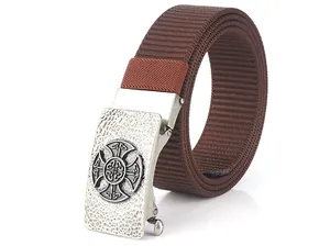 Detail of dark brown nylon belt showing the silver Celtic Cross metal buckle texture