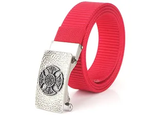 Detail of red canvas belt with vintage silver Celtic Cross metal buckle and woven texture