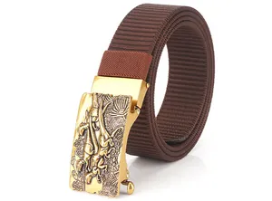 Close-up of golden alloy buckle with dinosaur relief on a brown woven nylon belt
