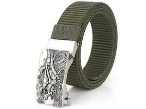 Detail of army green nylon belt with vintage embossed silver dinosaur buckle