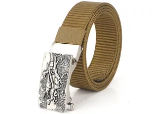 Macro detail of khaki nylon woven belt with a silver dinosaur embossed metal buckle