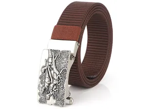 Detail of men's brown nylon belt with vintage dinosaur relief pattern metal buckle