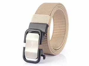 Detailed macro view of khaki nylon web belt with brushed metal automatic buckle