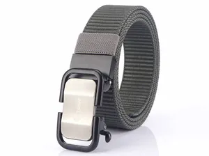 Close-up of military green nylon belt with metal automatic buckle and brushed silver panel