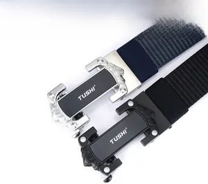 Detail of metal automatic buckles with lion head relief and textured nylon belts