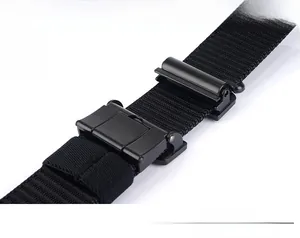 Detail of black nylon tactical belt with metal buckle and adjustable webbing strap