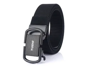 Close-up of black nylon belt with matte metal automatic buckle and TUSHI logo