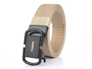 Detail of khaki nylon belt with black matte automatic buckle and brand logo engraving