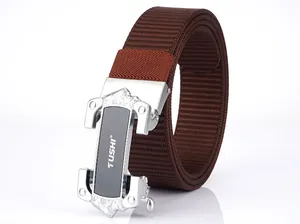 Detail of a brown woven nylon tactical belt with a metallic buckle and TUSHI logo