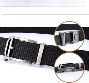Detailed view of the automatic buckle mechanism on black nylon canvas belt with webbing texture