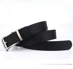 Detail of durable black nylon strap texture and matte metal buckle for outdoor belt