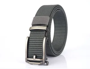 Detail of dark grey nylon canvas belt with a brushed gunmetal automatic buckle