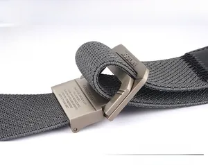 Detailed close-up of dark grey elastic woven belt featuring a matte metal buckle
