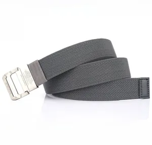 Close-up of a nylon belt showing the metal buckle with engraving and fabric texture