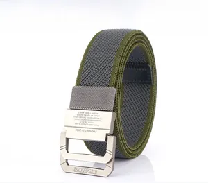 Detailed close-up of a nylon woven belt with double ring metal buckle and logo engraving