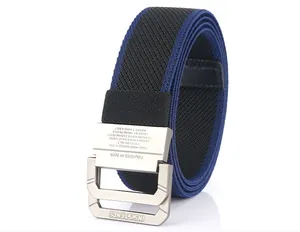 Detailed macro view of the metal D-ring buckle with brand engraving on nylon belt