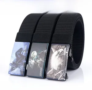Detail of zinc alloy automatic buckles with wolf and eagle patterns on nylon belts