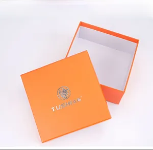 Square orange gift box with silver lion logo and textured finish for nylon belt