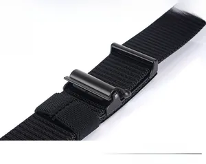 Detail of black nylon canvas belt featuring a sturdy black metal sliding adjustment buckle