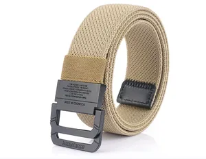 Detailed close-up of matte black double ring buckle on a tan elastic canvas belt