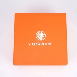 Orangefarbene Geschenkbox für Nylon-Gürtel mit dem TUSHI Löwenkopf-Markenlogo