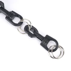 Detail of black plastic 360-degree rotating lobster clasp with dual metal key rings