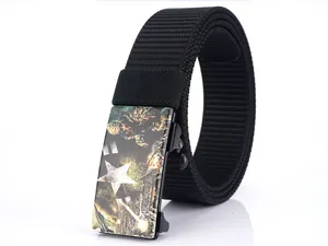 Detail of black nylon tactical belt featuring a military buckle with white star design