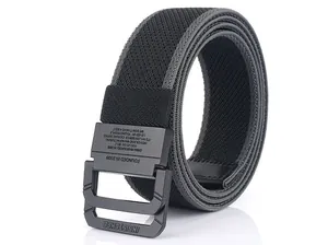 Close-up of matte black double ring buckle and textured nylon webbing on tactical belt